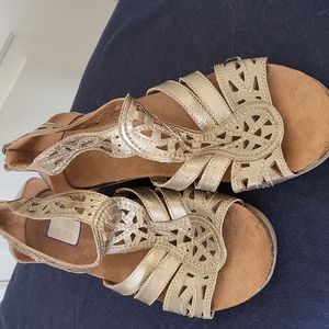Gold tone wedge sandals with zipper at the heel